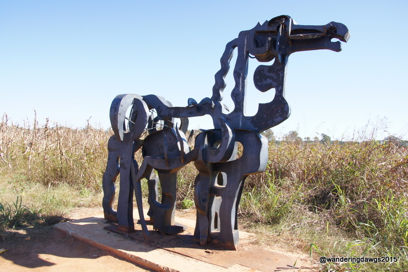The Iron Horse stands tall in the middle of a cornfield