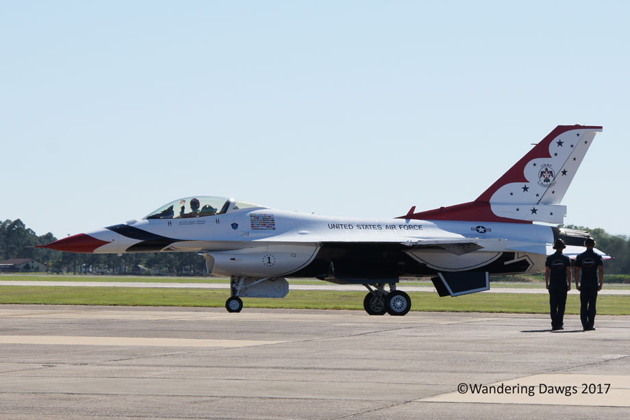 Thunderbird Pilot waves an American Flag as he taxies down the runway